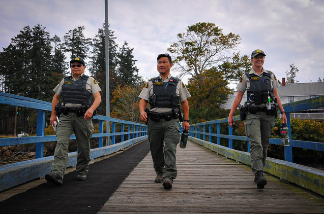 Fay Gin, a fisheries officer on loan from DFO's Steveston's detachment; Derek Chung, former commander of the Annacis Island Whale Protection Unit; and Scotti Griffin, a member of the unit, return to their patrol after lunch on Mayne Island, B.C. Credit: Stefan Labbé/Glacier Media.