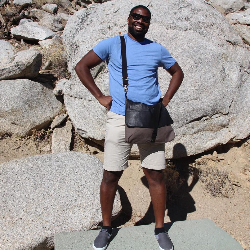 Happy customer Kalada with his easy to travel with messenger bag in sunny California.