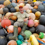 Artist Pete Clarkson sitting amidst the medium he uses for his sculptures. Credit: Clarkson