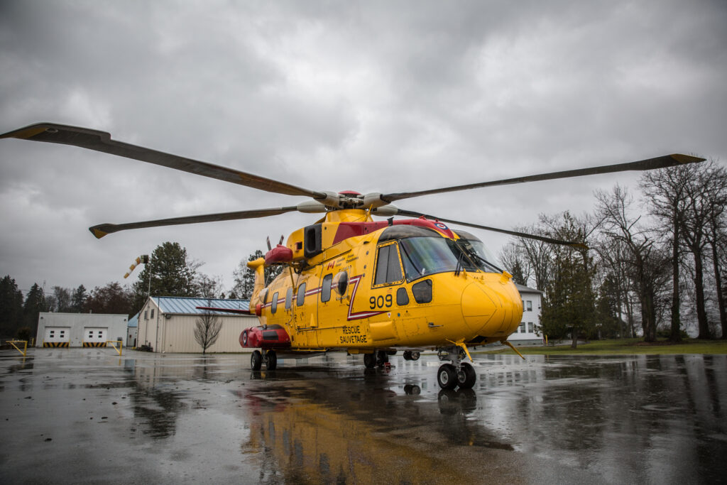 Vancouver, Canada - Mar 8, 2014: A Canadian Forces "Cormorant" Search and Rescue (SAR) helicopter on the helicopter pad of the Naval Reserve Unit HMCS Discovery in Vancouver, British Columbia on a rainy spring day in 2014. Canadian Forces search and rescue technicians and the Canadian Coast Guard were on a joint search and rescue exercise on the coast of British Columbia to prepare for emergencies.