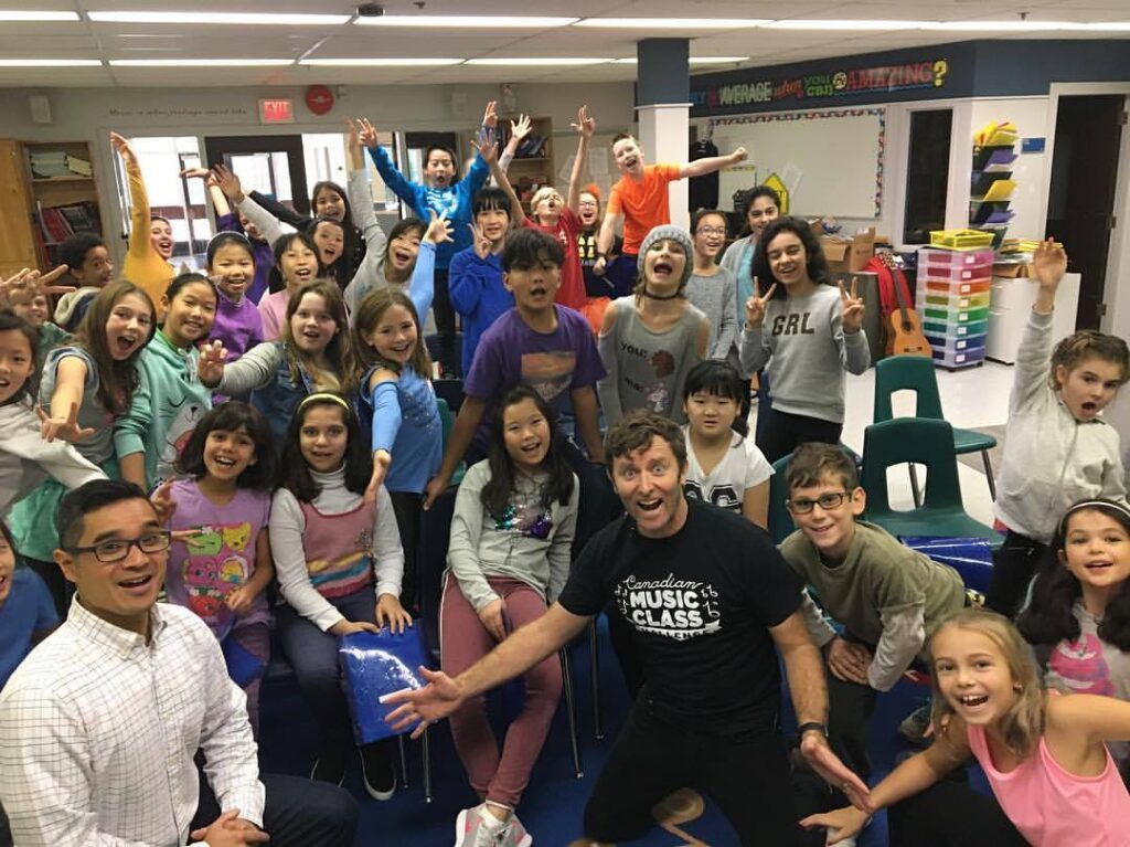 The elementary school of Irwin Park in West Vancouver. This is Mr. Santos' music class, who are taking part in the Canadian Music Class Challenge for @cbc_music.