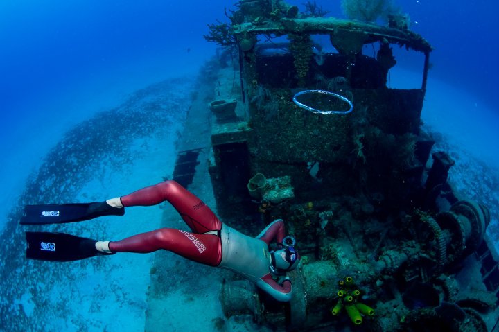 Free-diver blowing bubbles.