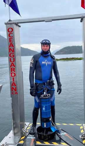 Kirk Krack standing in his diving suit.