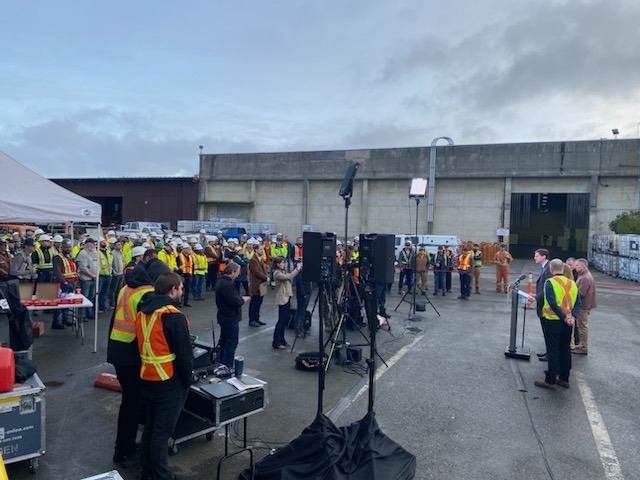 Workers watching the ceremony. 