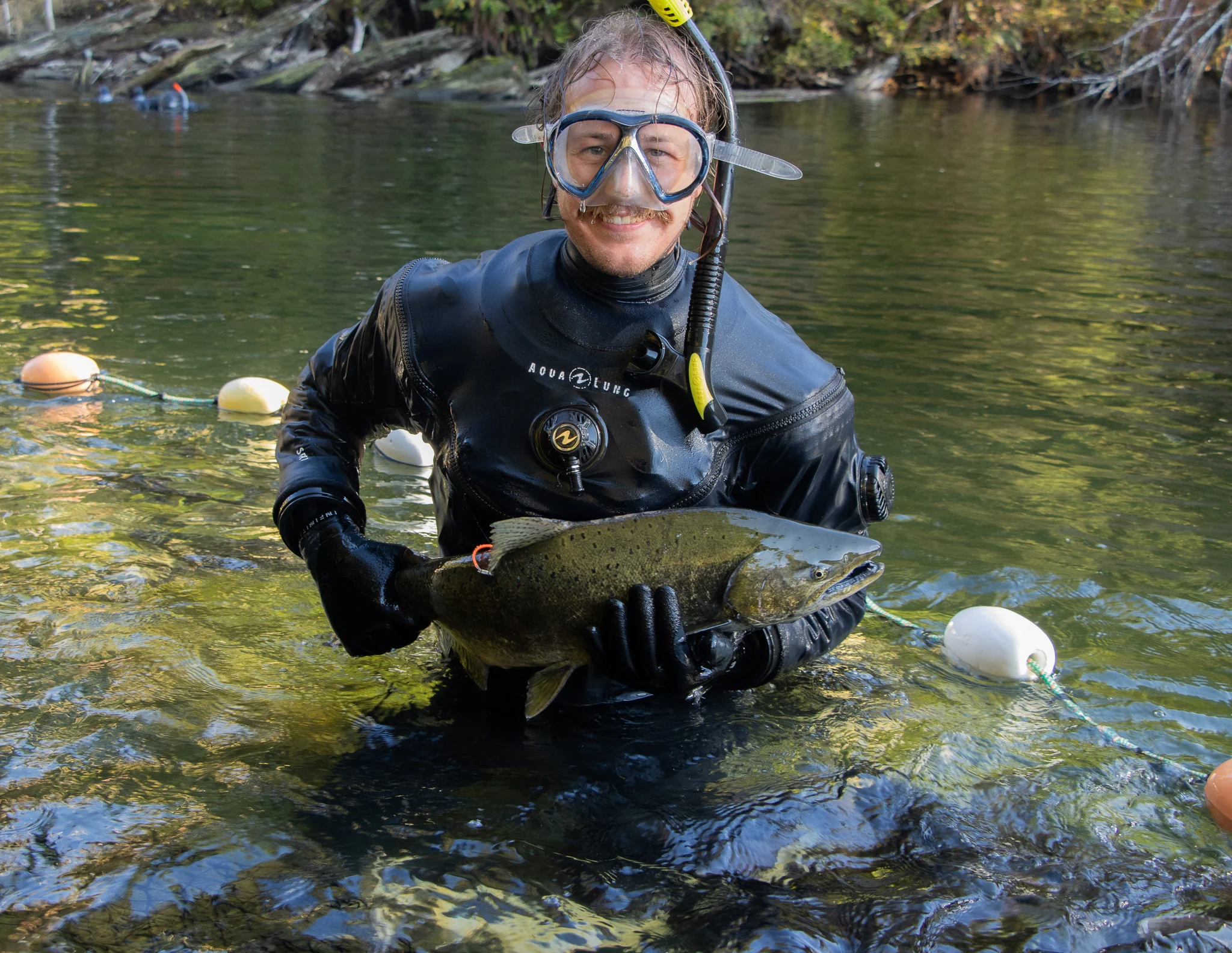 Zach Kapelan holds a chinook salmon.