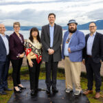 From left to right: Nathan Cullen, Minister of Water, Land and Resource Stewardship; Jennifer Rice, Parliamentary Secretary for Rural Health; K̓áwáziɫ Marilyn Slett, Chief Councillor of the Heiltsuk Nation and President of Coastal First Nations; Premier David Eby; Dallas Smith, President of Nanwakolas Council; and Eddy Adra, CEO of Coast Funds at the funding announcement in Vancouver.