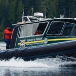 The Coastal Nations Coast Guard Auxiliary in a Search & Rescue boat.