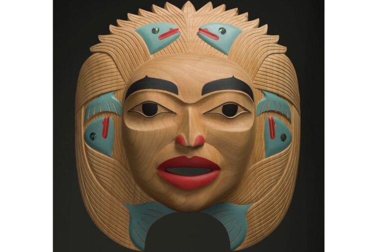 Dale Campbell's "Woman who Brought the Salmon" mask made of alder, abalone and pigment
